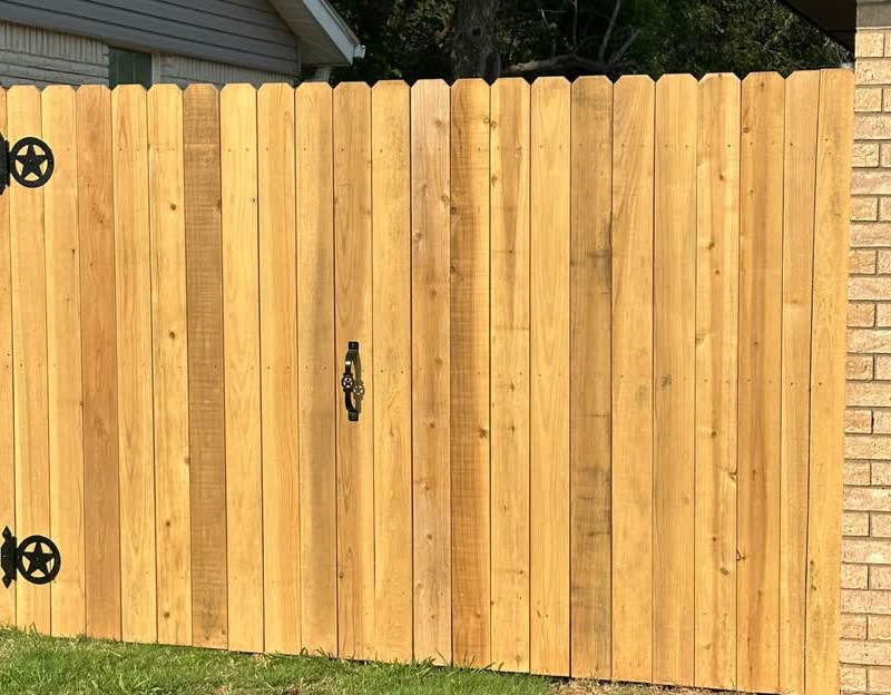 A new cedar privacy fence and gate in the same spot